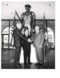 ["Black and white photograph of Carl Albert in front of a statue at the National Headquarters of the Reserve Officers' Association of the United States. Carl Albert is with two other men. A.S. Mike Monroney is present (at right). June 4, 1968"]