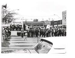 ["Black and white photograph of Carl Albert speaking at an outdoor American Legion event."]