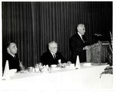 ["Black and white photograph of Carl Albert at a VFW dinner."]