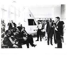 ["Black and white photograph of Dr. Joseph Shea. Apollo Spacecraft Program Office, briefing Hubert Humphrey on the Apollo Space Program. Fred Harris and Carl Albert are present. Manned Spacecraft Center, July 13, 1965"]