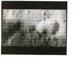 ["Black and white photograph of Moon taken by Orbiter I. August 18,1966."]