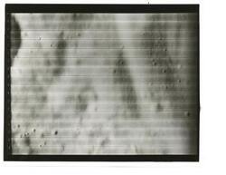 ["Black and white photograph of Moon taken by Orbiter I. August 18,1966."]