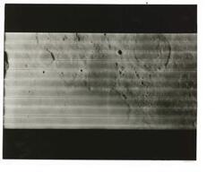 ["Black and white photograph of Moon taken by Orbiter I. August 18,1966."]
