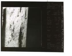 ["Black and white photograph of Moon taken by Surveyor I. Data on Surveyor 1's position at side of photo.  June 1966"]