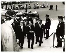 ["Black and white photograph of Hubert Humphrey with some unidentified men and Virgil Grissom."]