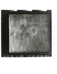 ["Black and white photograph of Mars by Mariner IV. July 14, 1967"]
