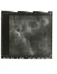 ["Black and white photograph of Mars by Mariner IV. July 14, 1969"]