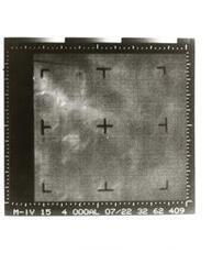 ["Black and white photograph of Mars by Mariner IV. July 14, 1971"]