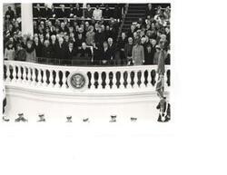 ["Black and white photograph of Richard Nixon's Second Term Inauguration. Pictured are Julie Nixon Eisenhower, Mamie Eisenhower, George Schultz, Patricia Nixon, William P. Rogers, Warren Burger, Richard M. Nixon, Spiro T. Agnew, Mrs. Spiro T. Agnew, Carl Albert, William O. Douglas, William Brennan, George Romney, John N. Mitchell, and John B. Connally. January 20, 1973"]