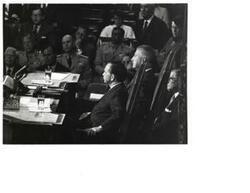 ["Black and white photograph of Carl Albert seated in the Speaker's chair."]