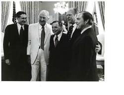 ["Black and white photograph of Carl Albert standing with John McFall, Leslie Arends, Gerald R. Ford, and John Rhodes."]