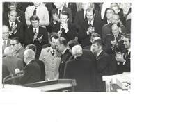 ["Black and white photograph of Valery Giscard D'Estaing (president of France), George S. McGovern, Patrick Leahy, Joseph Biden, Claiborne Pell, and others clapping."]