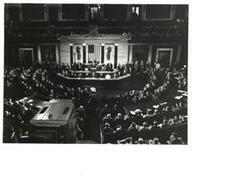 ["Black and white photograph of a session of Congress."]