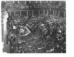 ["Black and white photograph of Carl Albert standing with an unidentified man."]