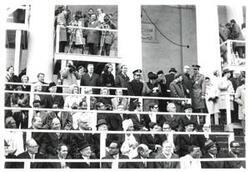["Black and white photograph of a large group of people in the background of Richard M. Nixon's 2nd term presidential inauguration. January 20, 1973"]