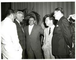 ["Black and white photograph of Reception following a retreat review honoring Army veterans of the 87th Congress. From left: W. J. Bryan Dorn (South Carolina), J. Glenn Beall (Maryland) Olin Teague (Texas), Carl Albert, and Secretary of the Army Elvis Stahr. June 4, 1961"]