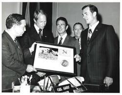 ["Black and white photograph of Presentation of Apollo 15 plaque in Speaker's office. July 26, 1971"]