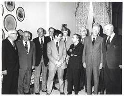 ["Black and white photograph of Carl Albert, Thomas P. O'Neill, and John J. McFall with a group in speaker's office. John Anderson, Olin Teague, and Leslie Arends are also pictured."]