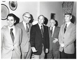 ["Black and white photograph of five men in what appears to be Carl Albert's office."]