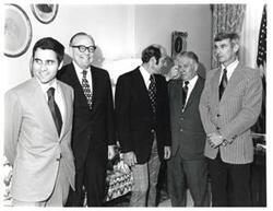 ["Black and white photograph of five men in what appears to be Carl Albert's office."]
