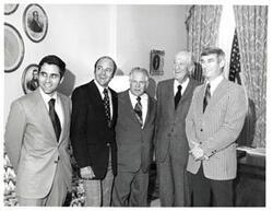 ["Black and white photograph of five men in what appears to be Carl Albert's office."]