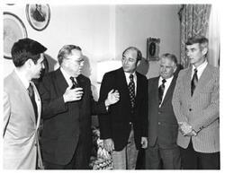 ["Black and white photograph of Thomas P. O'Neill with a group in Speaker's office."]