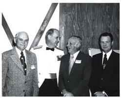 ["Black and white photograph of a group of men at the Armed Forces Day celebration in McAlester, Oklahoma. May 19, 1973"]