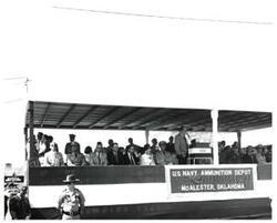 ["Black and white photograph of Speaker's stand at Armed Forces Day in McAlester, Oklahoma. 1973"]