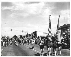 ["Black and white photograph of parade on Armed Forces Day in McAlester, Oklahoma. 1973"]