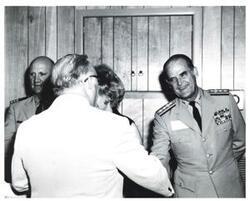 ["Black and white photograph of the receiving line at a banquet on Armed Forces Day in McAlester, Oklahoma 1973"]
