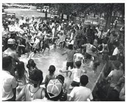 ["Black and white photograph of \"hogging\" fish in McAlester, Oklahoma on Armed Forces Day. 1973."]