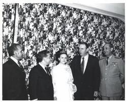 ["Black and white photograph of Carl Albert and Henry Bellmon in McAlester, Oklahoma on Armed Forces Day. 1973.  Two other unidentified men in photo."]