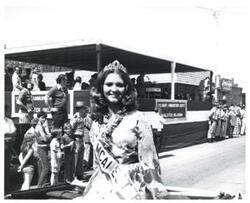 ["Black and white photograph of a parade in McAlester, Oklahoma on Armed Forces Day. 1975"]