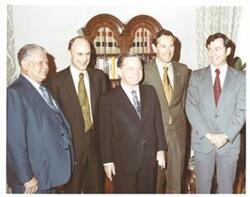 ["Color photograph of Carl Albert with astronauts in Speaker's office."]