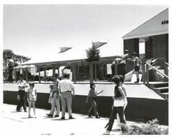 ["Black and white photograph of Naval Depot in McAlester, Oklahoma on Armed Forces Day."]