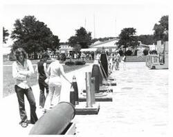 ["Black and white photograph of the naval Depot in McAlester, Oklahoma on Armed Forces Day."]