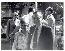 ["Black and white photograph of Carl Albert and a young boy in McAlester, Oklahoma on Armed Forces Day. May 18, 1974"]