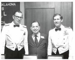 ["Black and white photograph of Carl Albert with two military officers in McAlester, Oklahoma on Armed Forces Day. 1974"]