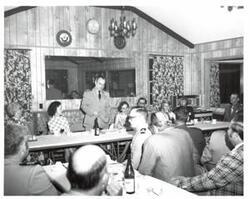 ["Black and white photograph of a banquet in McAlester, Oklahoma on Armed Forces Day. 1974"]