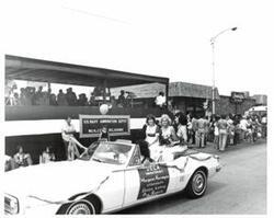 ["Black and white photograph of parade scenes in McAlester, Oklahoma on Armed Forces Day. 1974"]