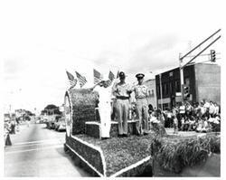 ["Black and white photograph of parade scenes in McAlester, Oklahoma on Armed Forces Day. 1974"]