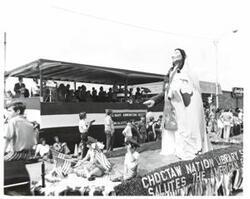 ["Black and white photograph of parade scenes in McAlester, Oklahoma on Armed Forces Day. 1974"]