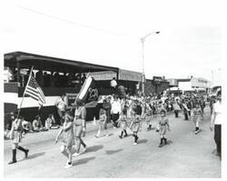 ["Black and white photograph of parade scenes in McAlester, Oklahoma on Armed Forces Day. 1974"]