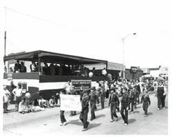["Black and white photograph of parade scenes in McAlester, Oklahoma on Armed Forces Day. 1974"]