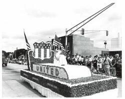 ["Black and white photograph of parade scenes in McAlester, Oklahoma on Armed Forces Day. 1974"]