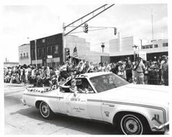 ["Black and white photograph of parade scenes in McAlester, Oklahoma on Armed Forces Day. 1974"]