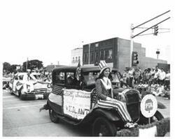 ["Black and white photograph of parade scenes in McAlester, Oklahoma on Armed Forces Day. 1974"]