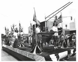 ["Black and white photograph of parade scenes in McAlester, Oklahoma on Armed Forces Day. 1974"]