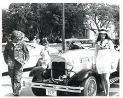 ["Black and white photograph of parade scenes in McAlester, Oklahoma on Armed Forces Day. 1974"]