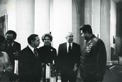 ["Black and white photograph print of Carl Albert speaking with several unidentified people during the House delegation trip to the USSR, Romania, and Yugoslavia. August 1975"]